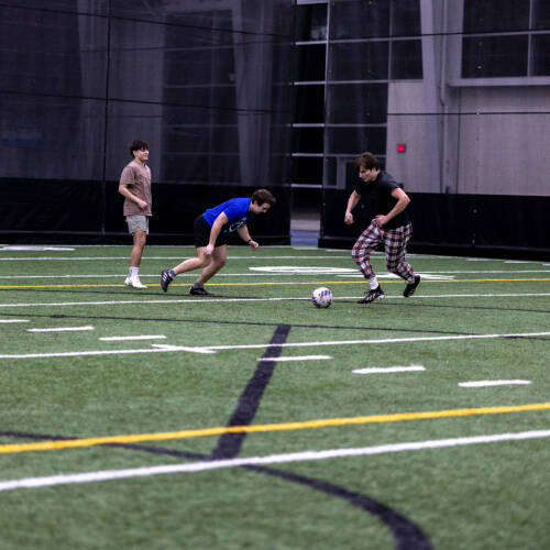 students playing indoor soccer